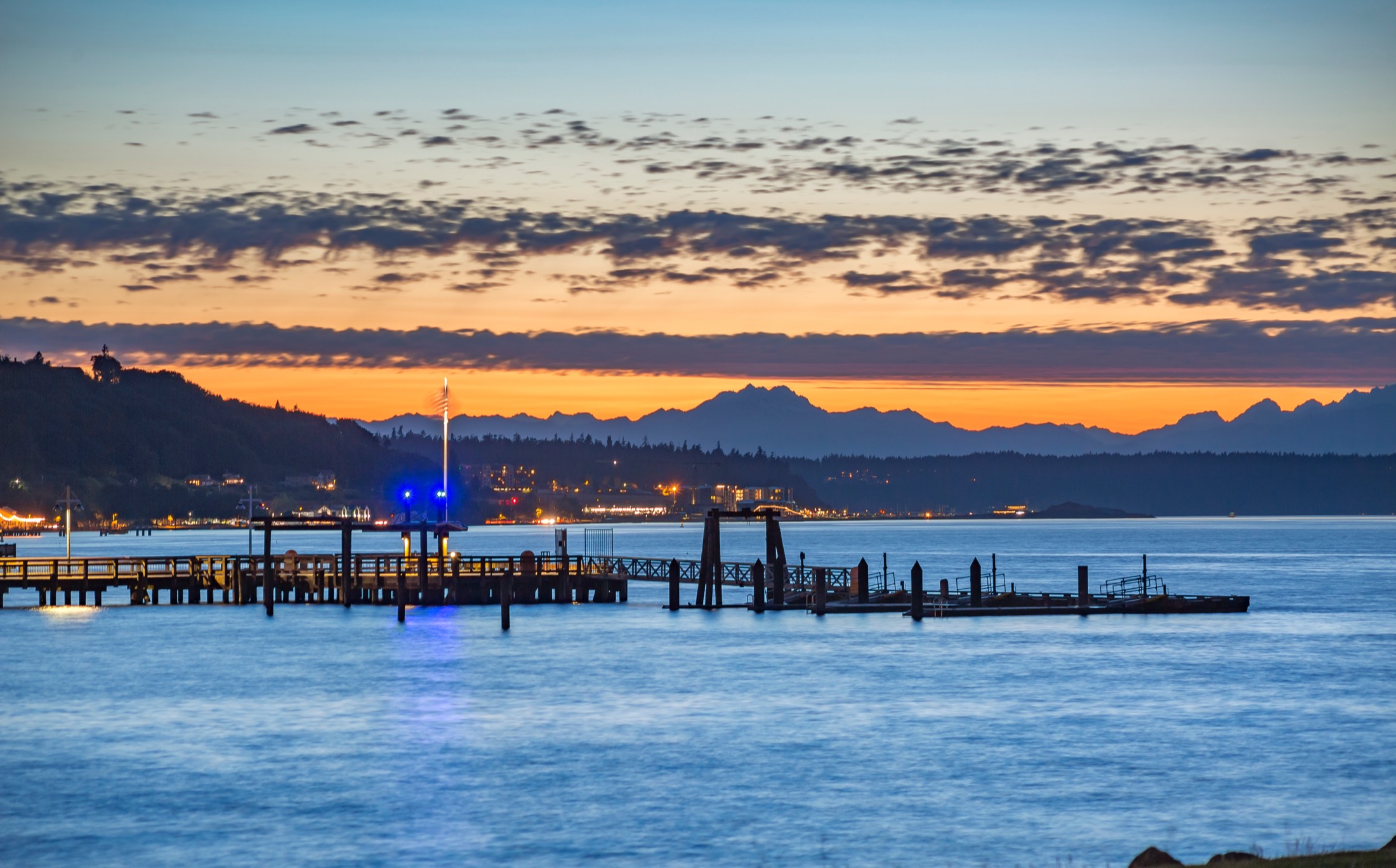 Tacoma docks at sunset with the mountains in the background